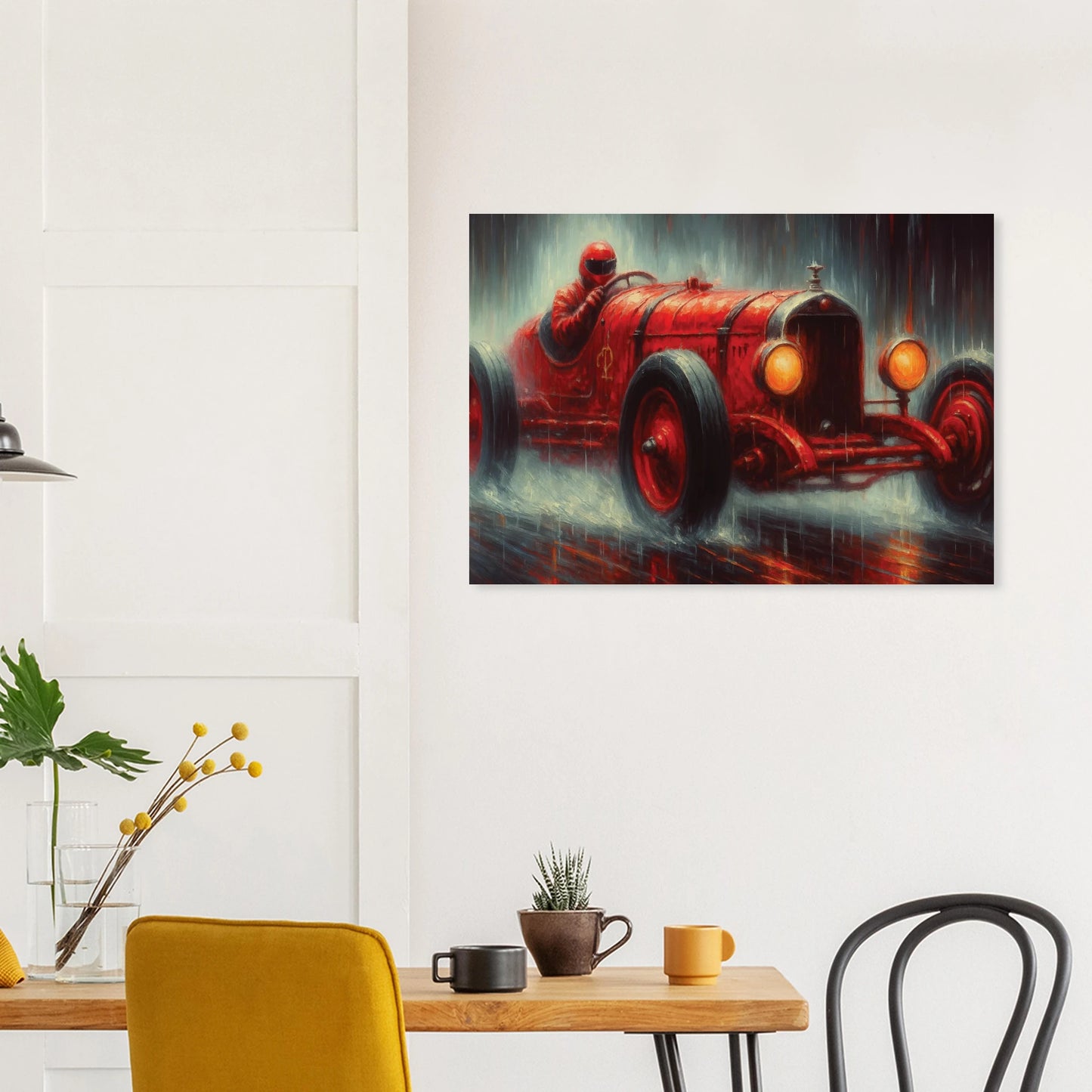 Unframed wall art print of a red vintage car on a wall above a table with decor items.